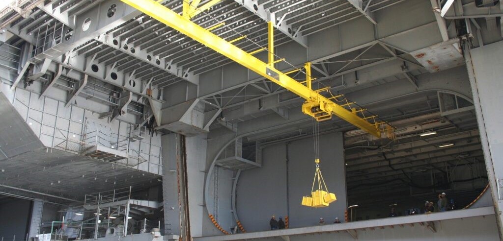 An indoor instrustrial crane being test