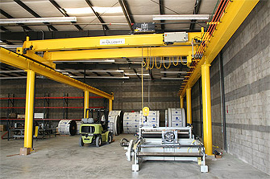 An indoor instrustrial crane being test