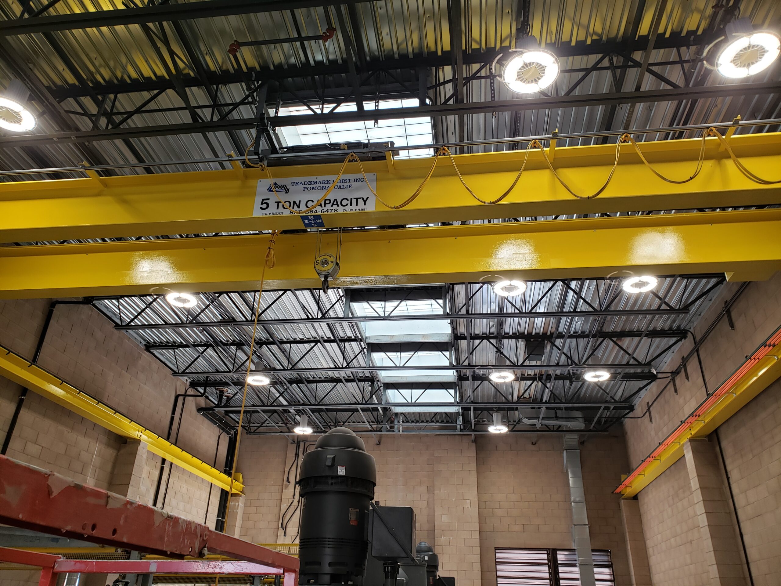 Warehouse interior with yellow crane