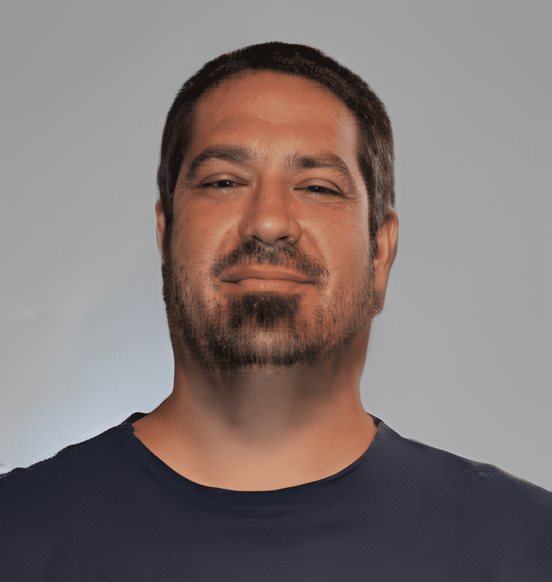 Man in dark shirt against gray background