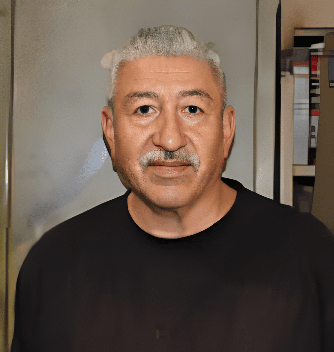Older man with gray hair indoors