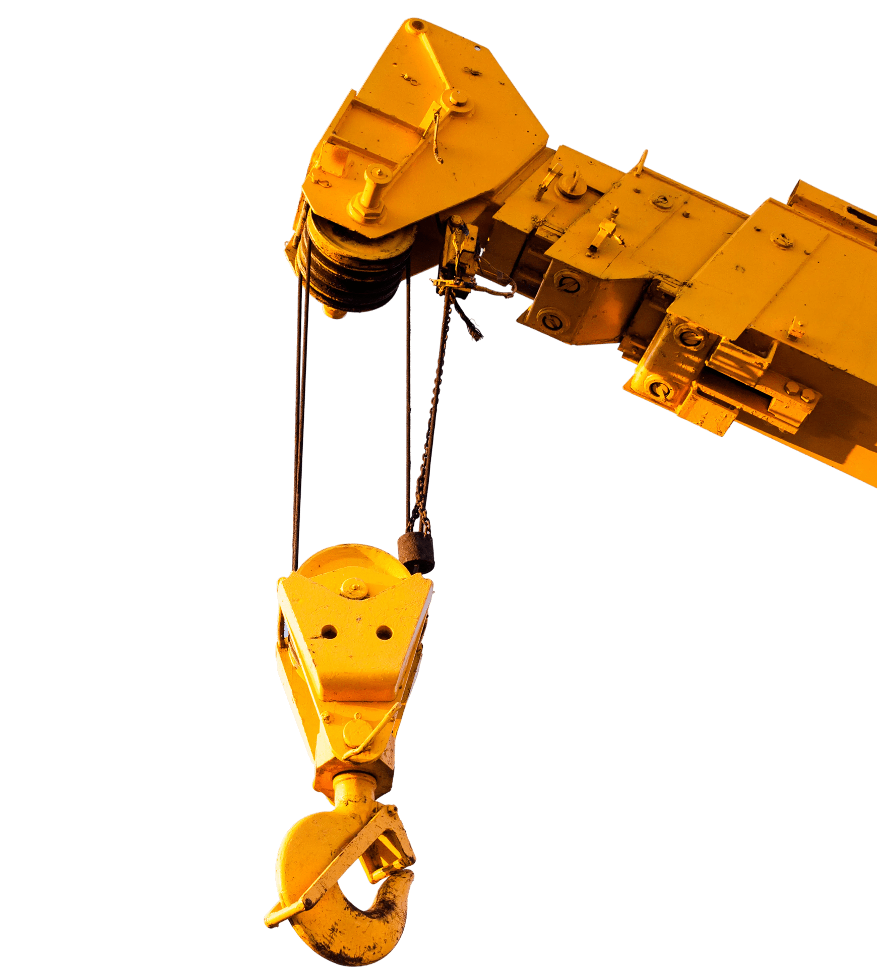 Yellow crane hook against black background