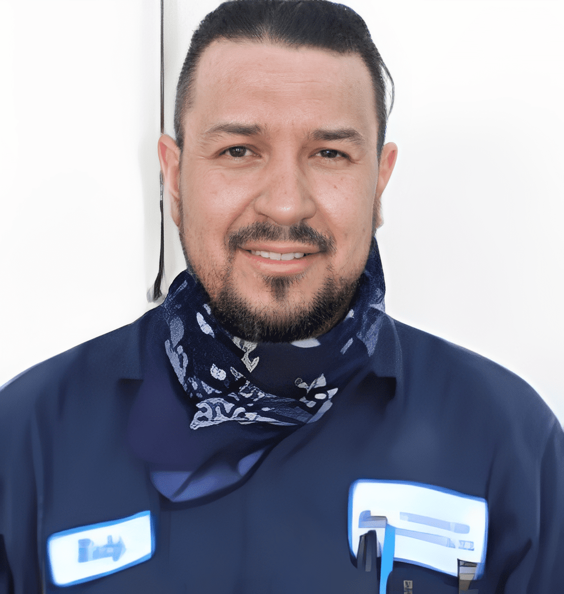 Man in work uniform smiling
