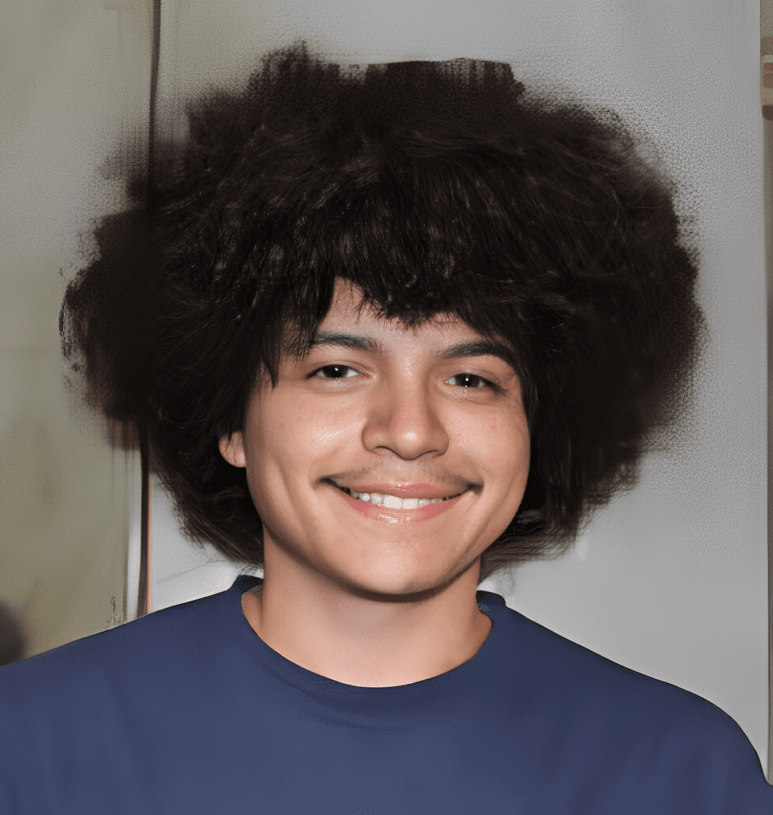 Young person in blue shirt