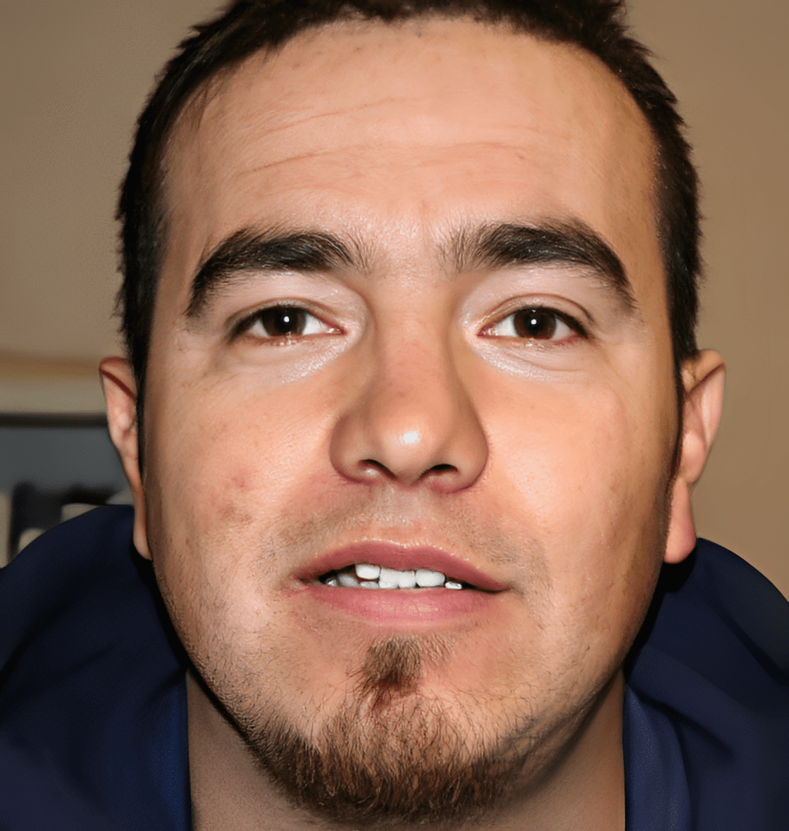 Man with short dark hair and beard