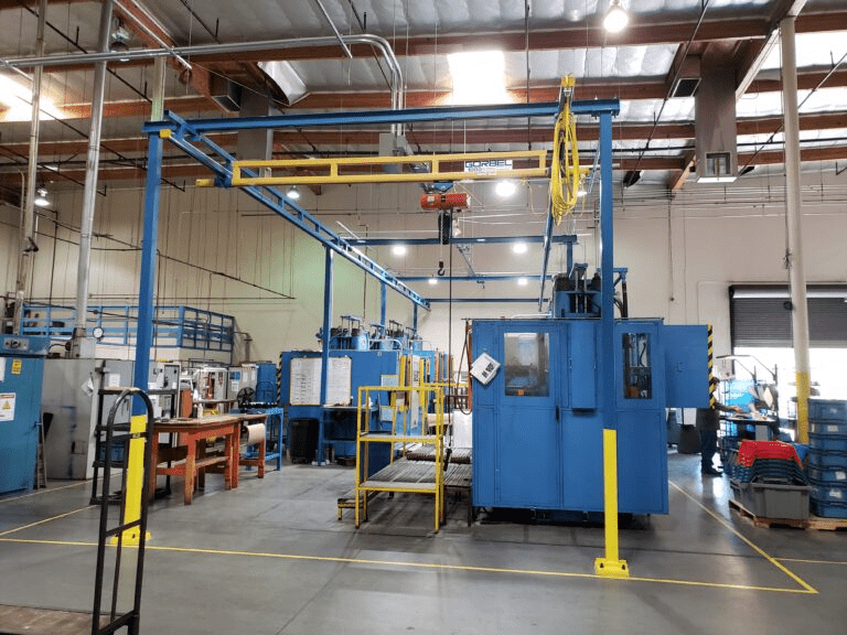 Blue manufacturing equipment in warehouse